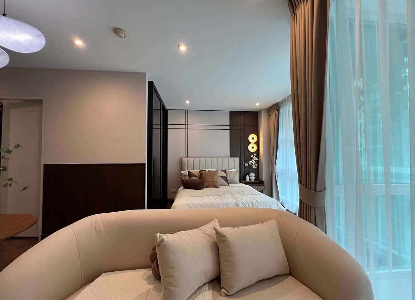 D65 Condominium: Living area and bedroom